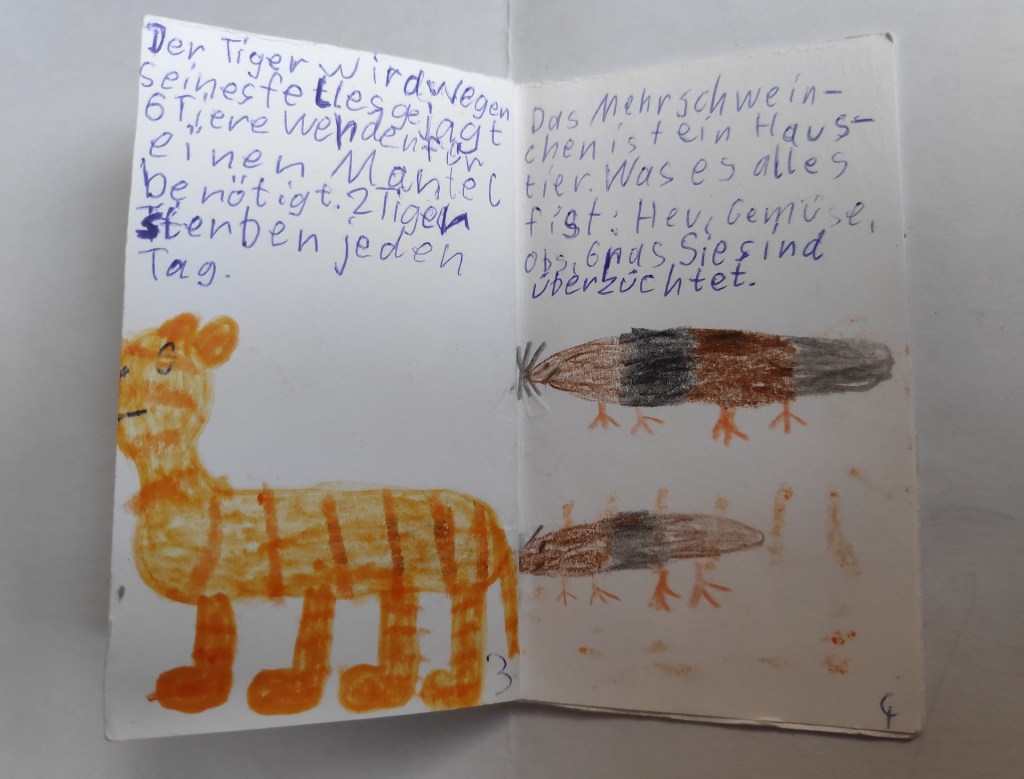 Minibuch von Kind gemacht: Titel: "Viele Tiere" mit Tiger und Meerschweinchen